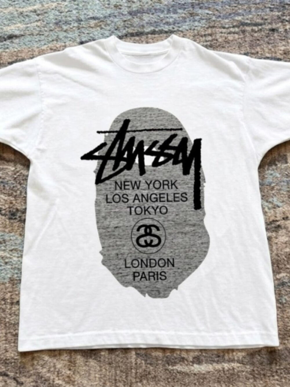 Stüssy New York London Tokyo Paris Graphic T-Shirt